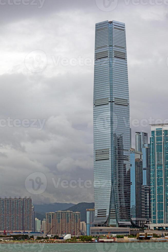 Skyscraper in a cloudy urban skyline, blending modern architecture with dramatic weather contrasts photo