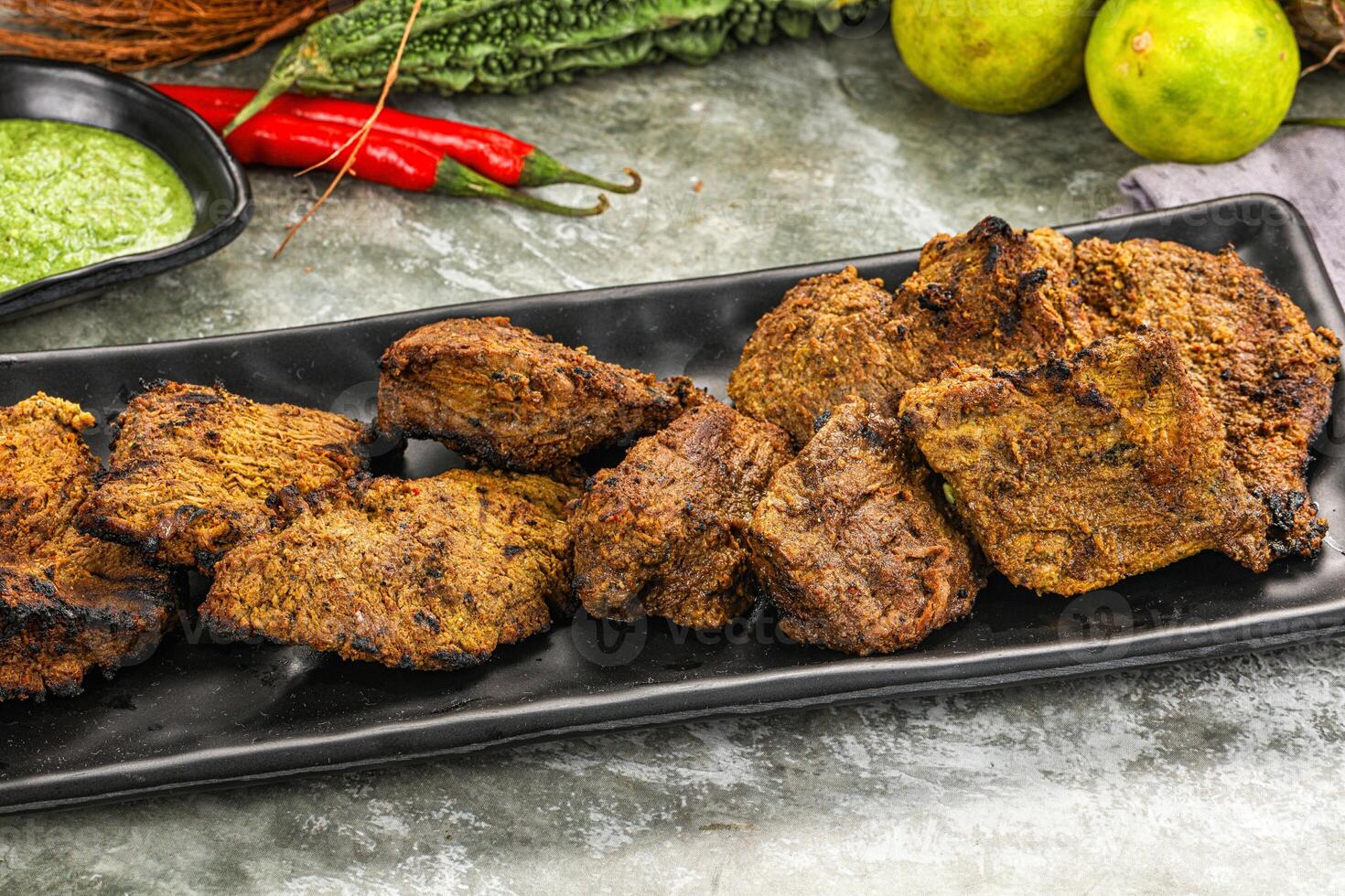 Grilled beef barbecue with spises photo