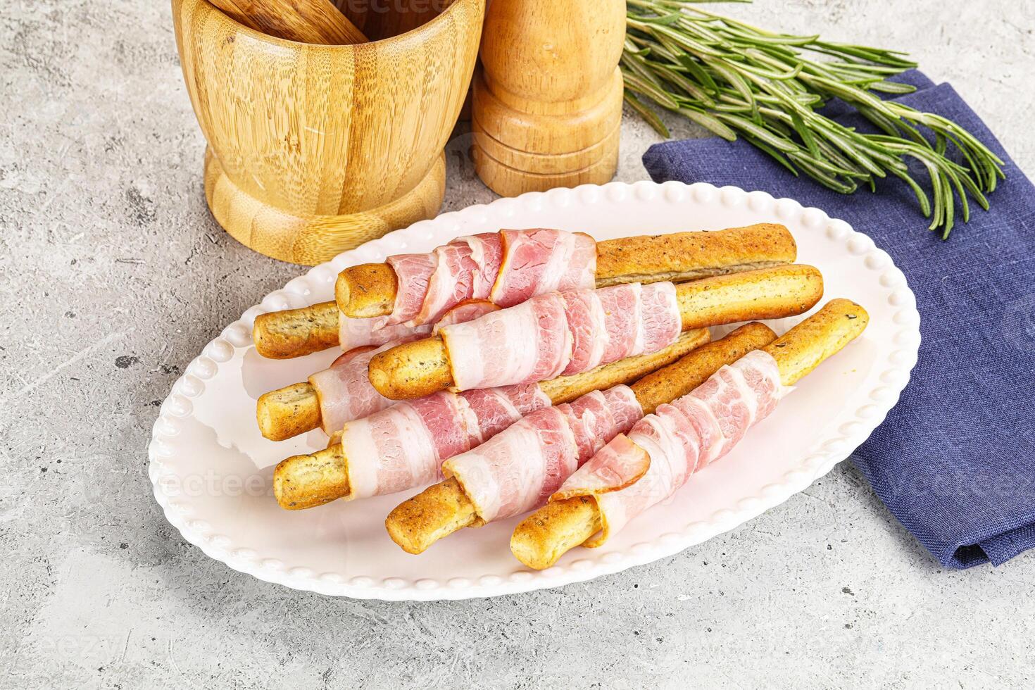 Crispy grissini italian bread with bacon photo