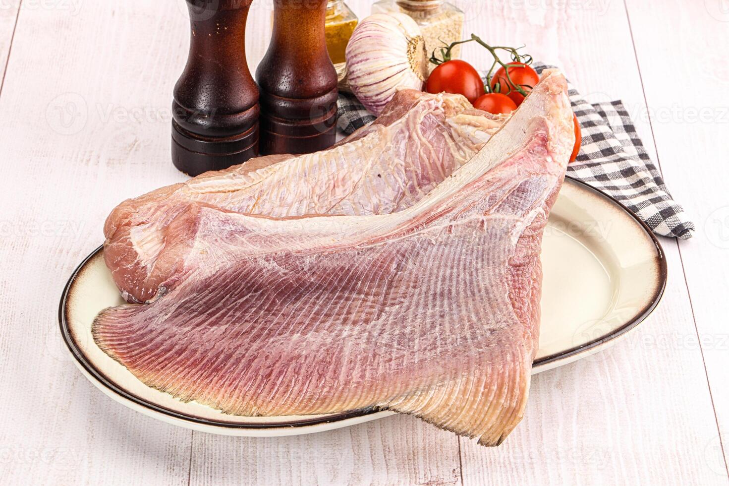 Raw uncooked stingray fish wing photo