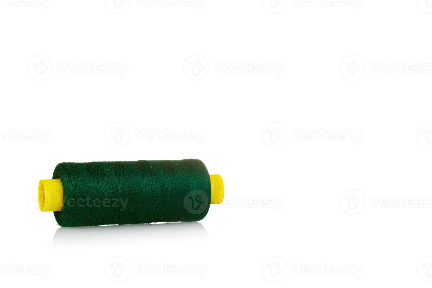 skein of thread green colors macro on a white background photo
