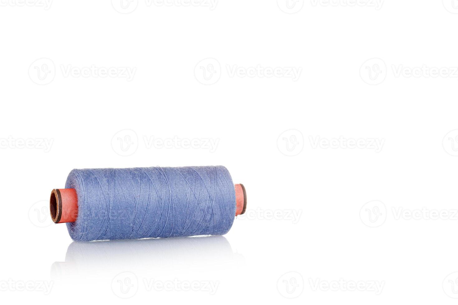 a skein of threads of blue color macro on a white background close up photo