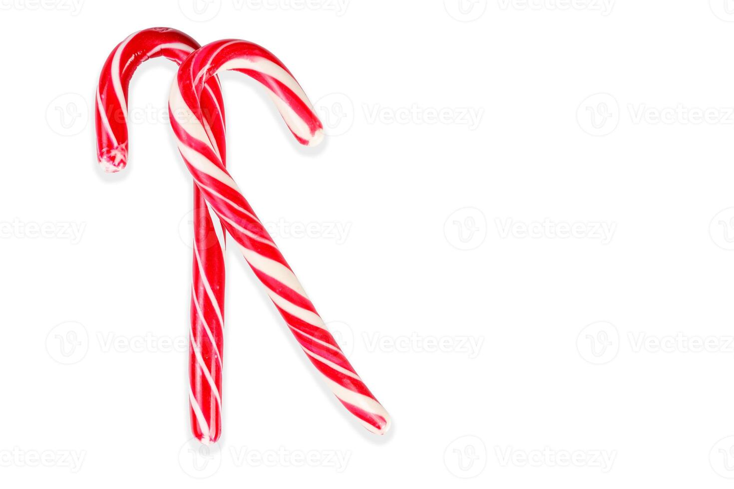 New Year's sticks candy canes with stripes on a white isolated background photo
