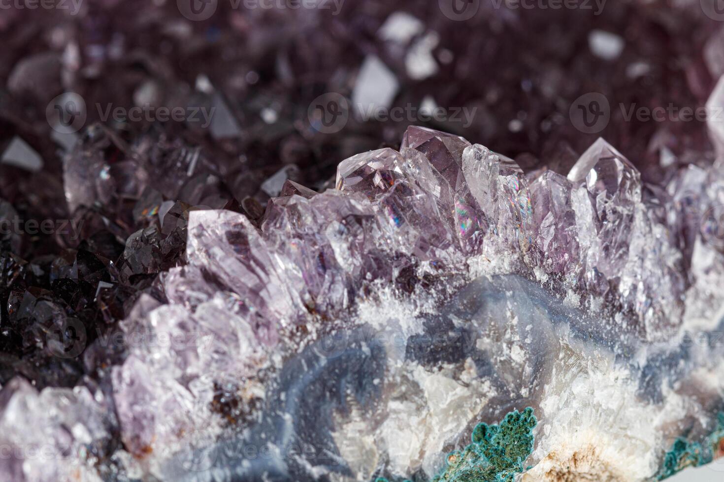 Amethyst mineral stone macro on white background photo