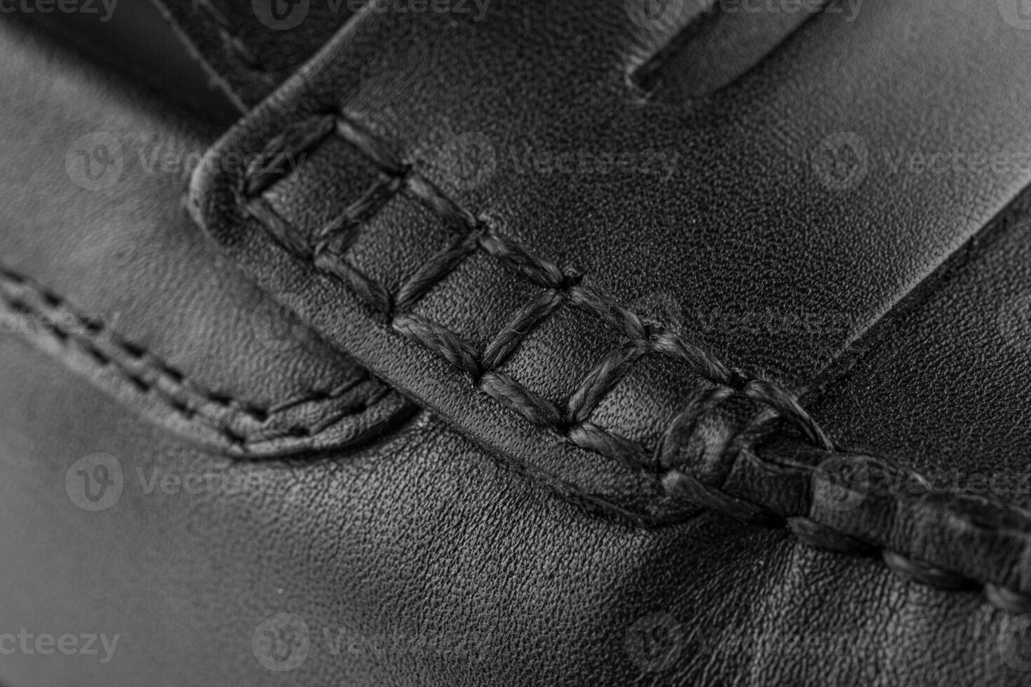 texture of black leather with thread stitching photo