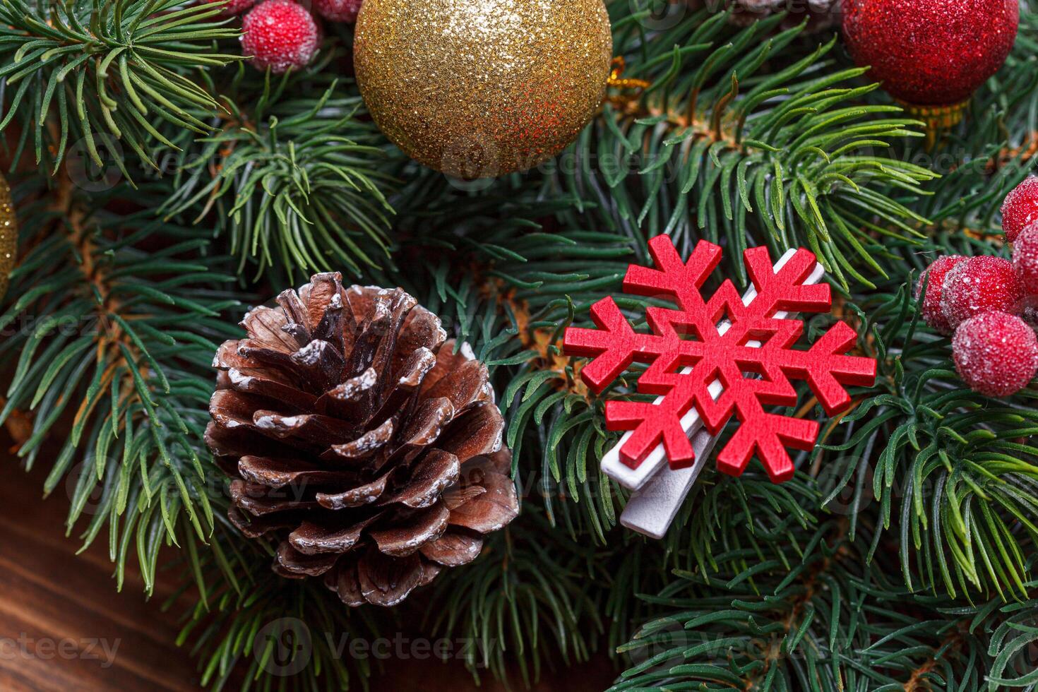 beautiful branches of the Christmas tree with cones and toys photo