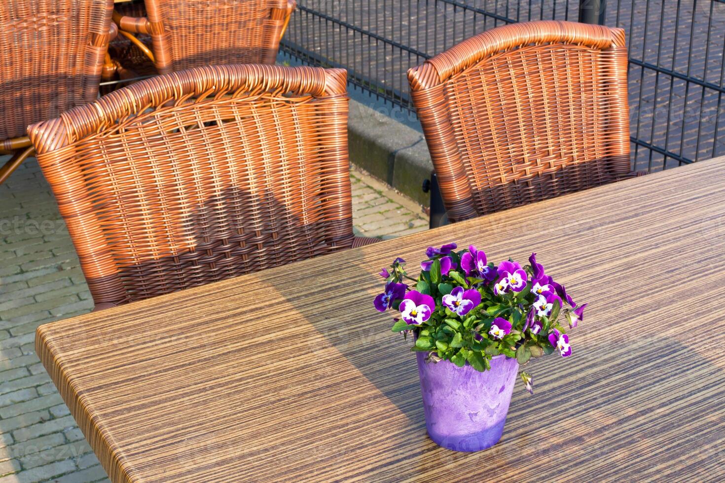 Wicker cafe tables and chairs photo