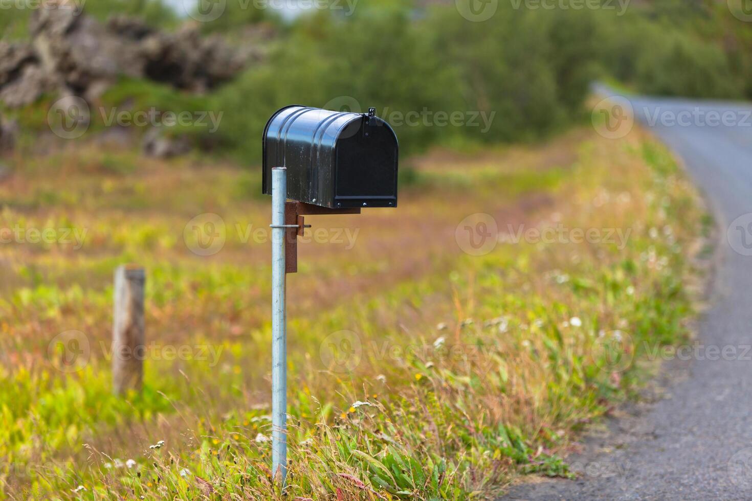 Old Weathered Mailbox at Rural Roadside in Iceland photo