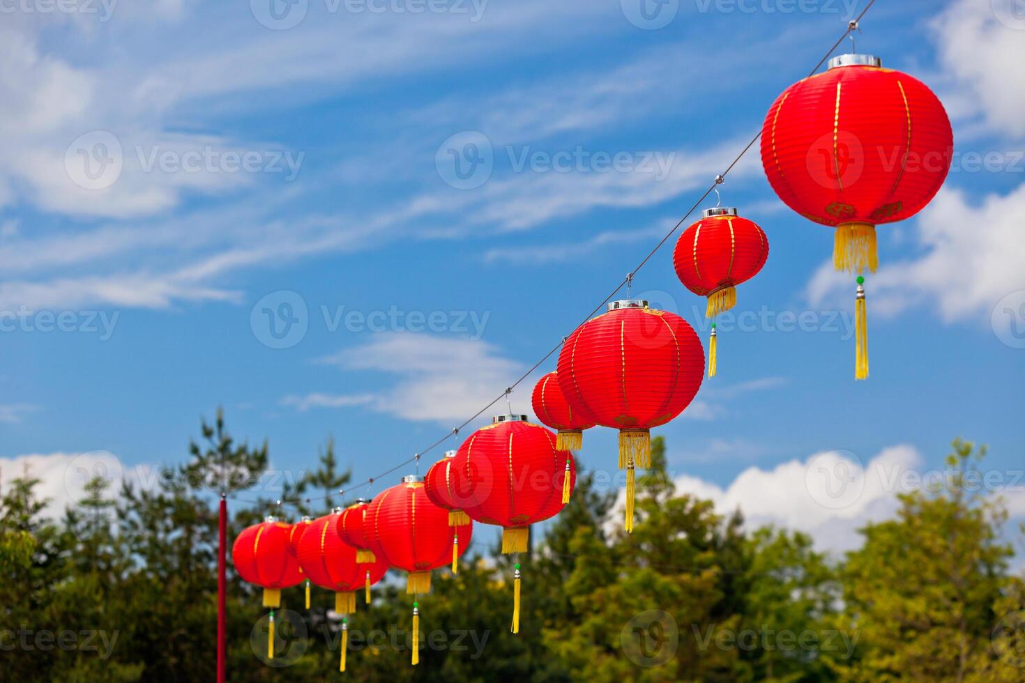 Red Chinese Paper Lanterns against a Blue Sky photo