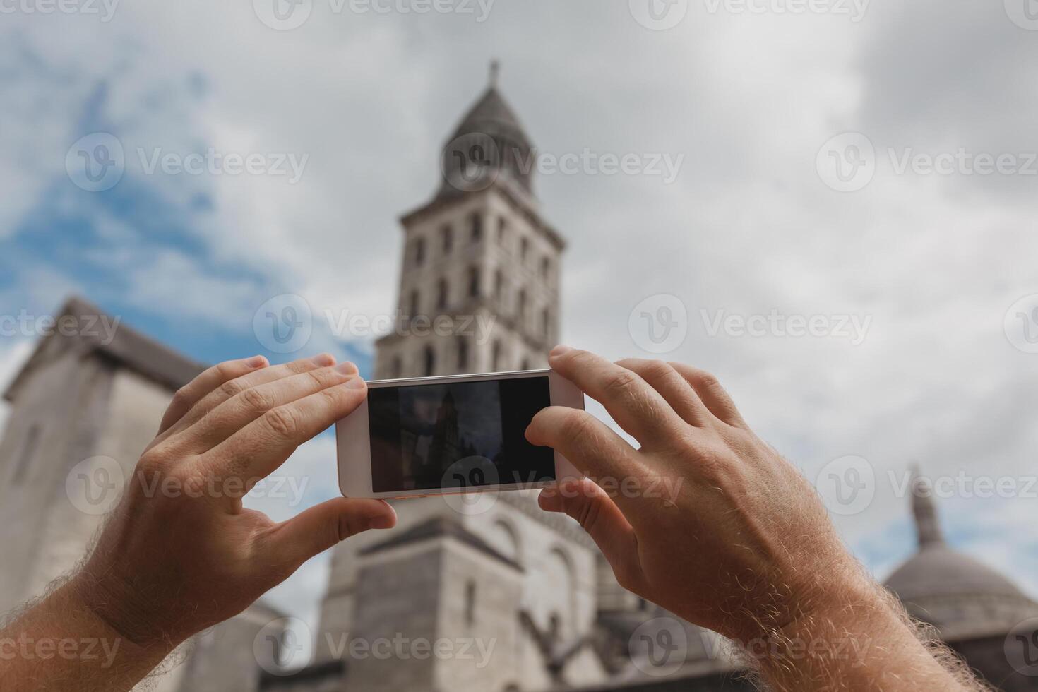 Tourist taking photo of Perigueux, France