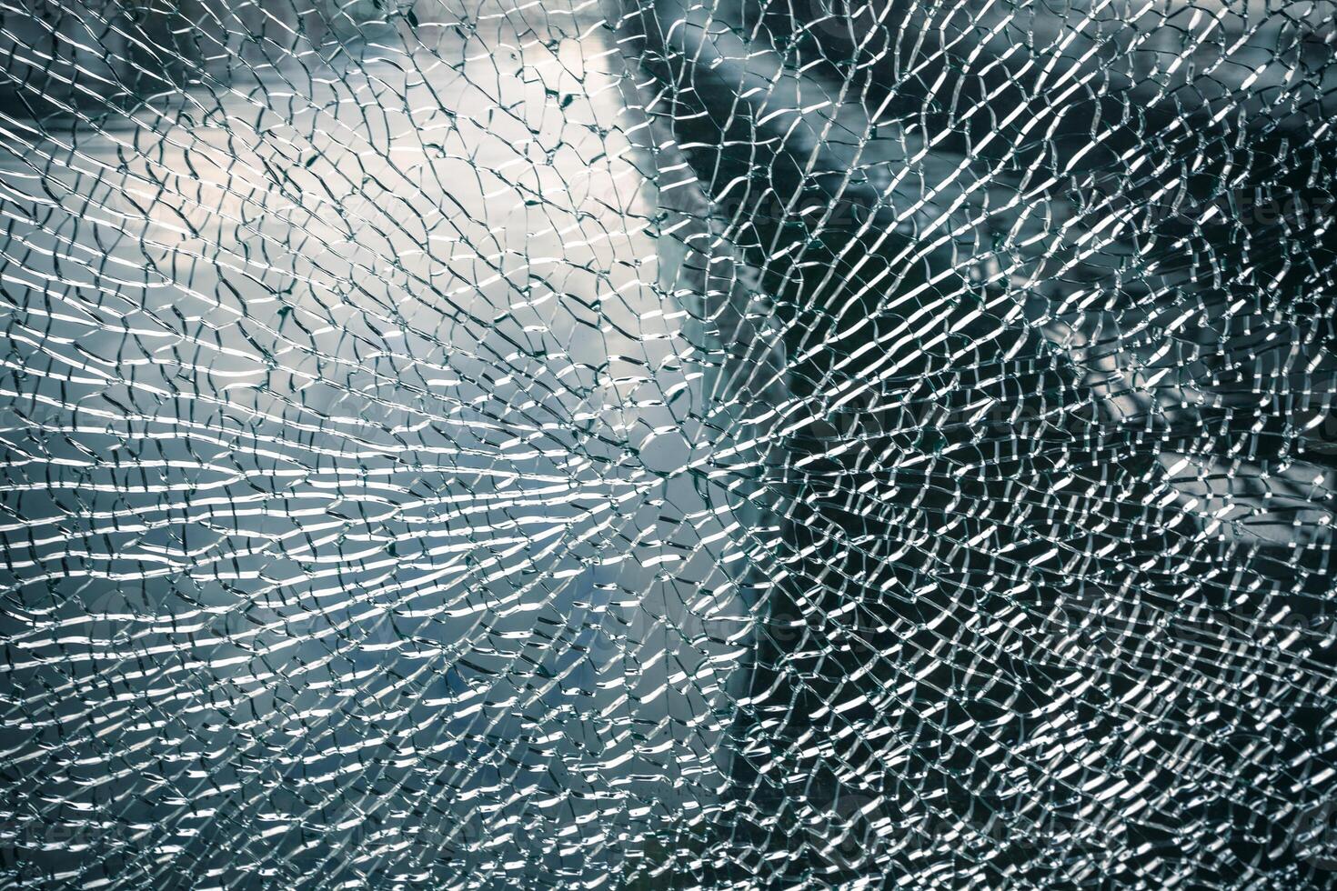 Cracked window broken glass background photo