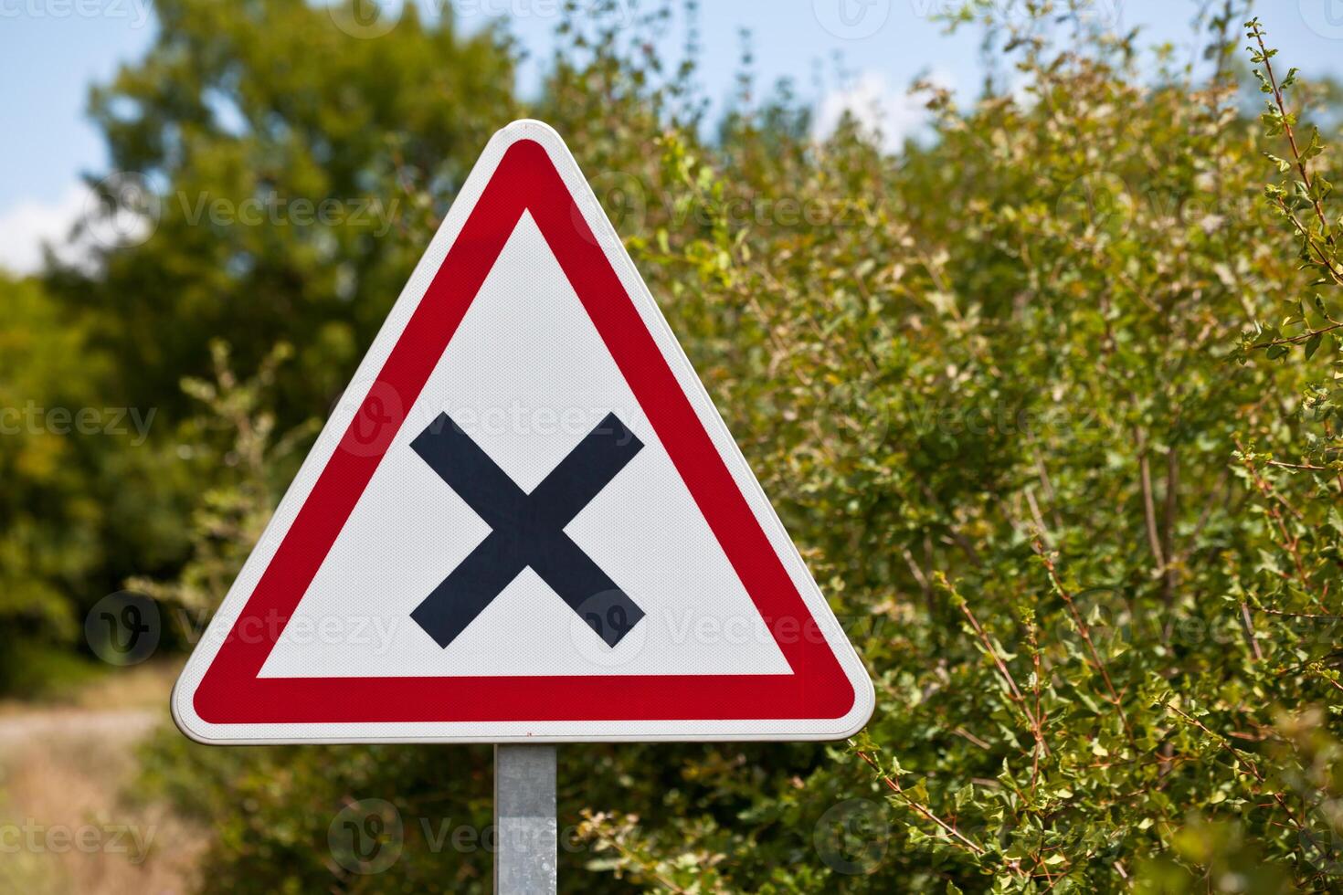 Crossroads road sign on a country road photo