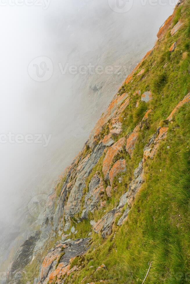 The Grossglockner mountains in foggy weather photo