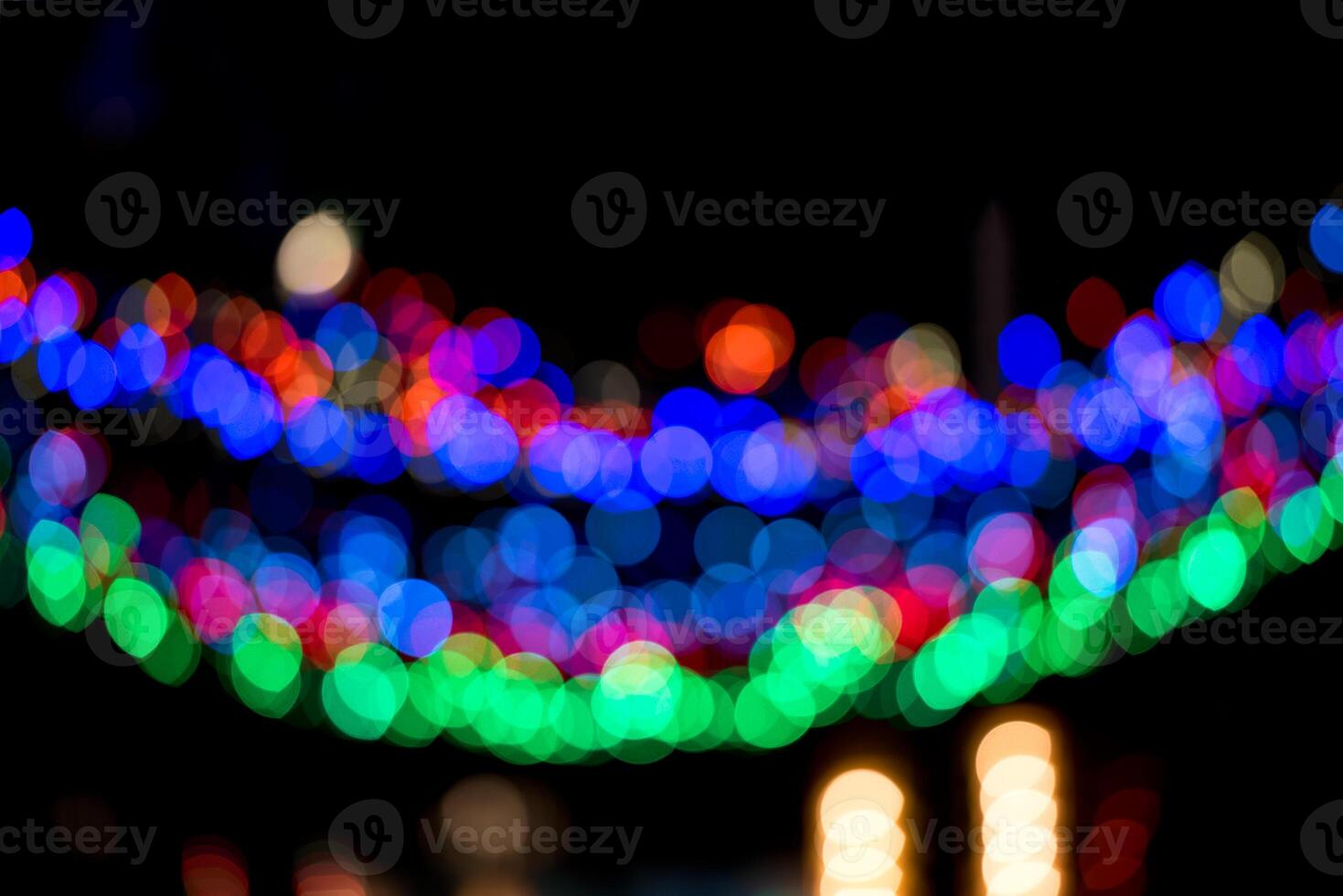 Colorful Christmas garland blurred and defocused with bokeh photo