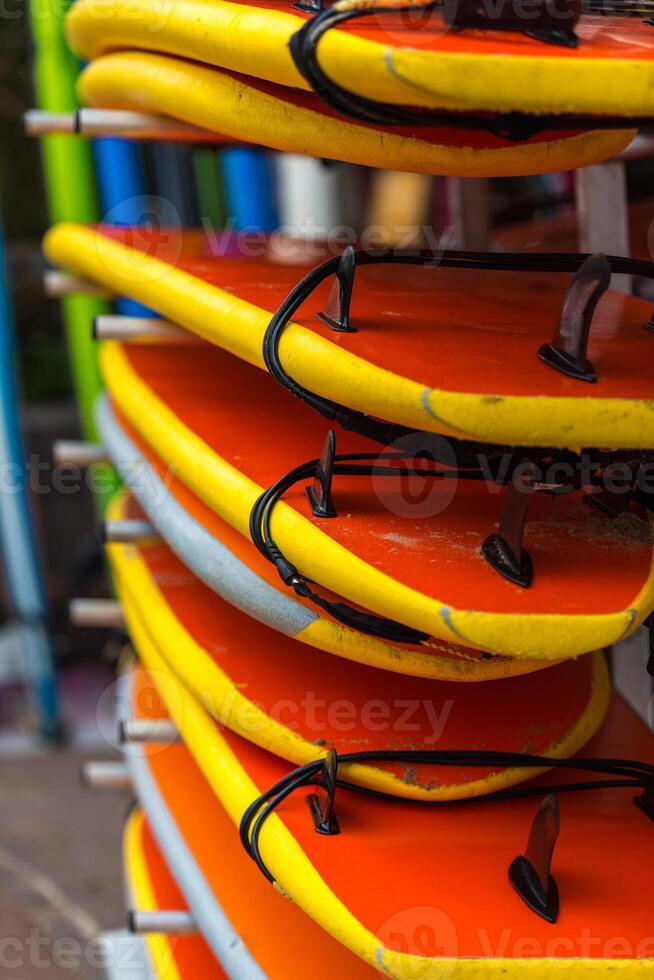 Surf boards in a stack photo