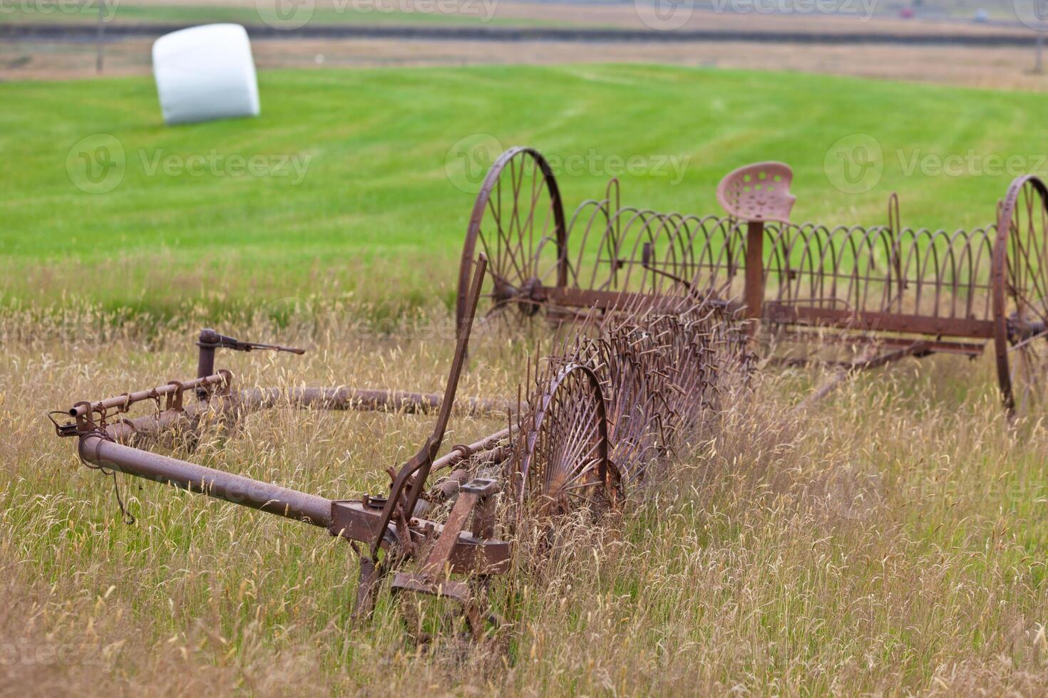 Rusty plows on a field of Iceland photo