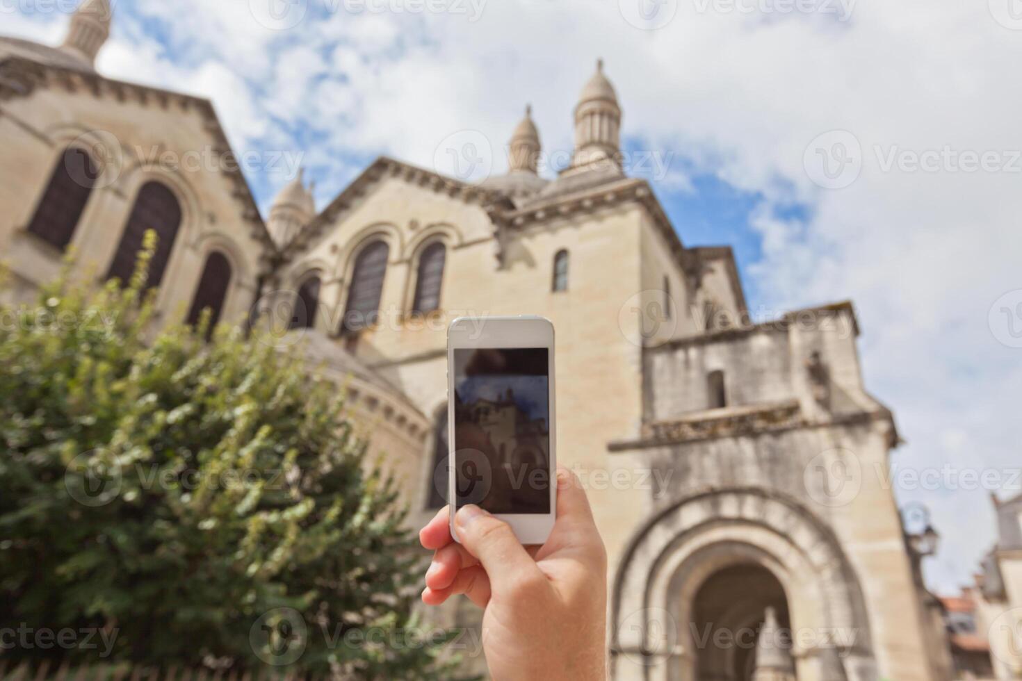 Tourist taking photo of Perigueux, France