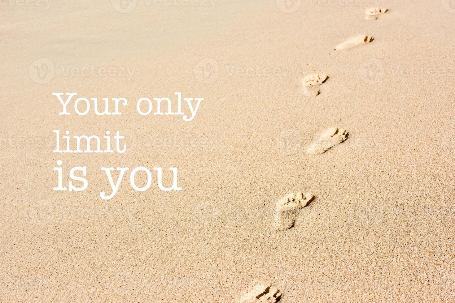 Inspirational motivation quote footprints on beach sand photo