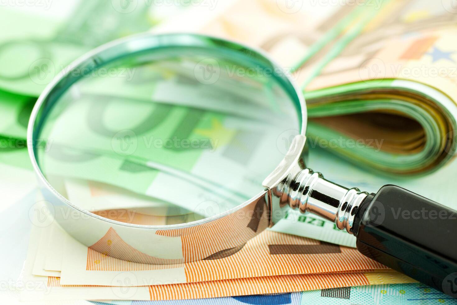 euro notes with magnifier photo