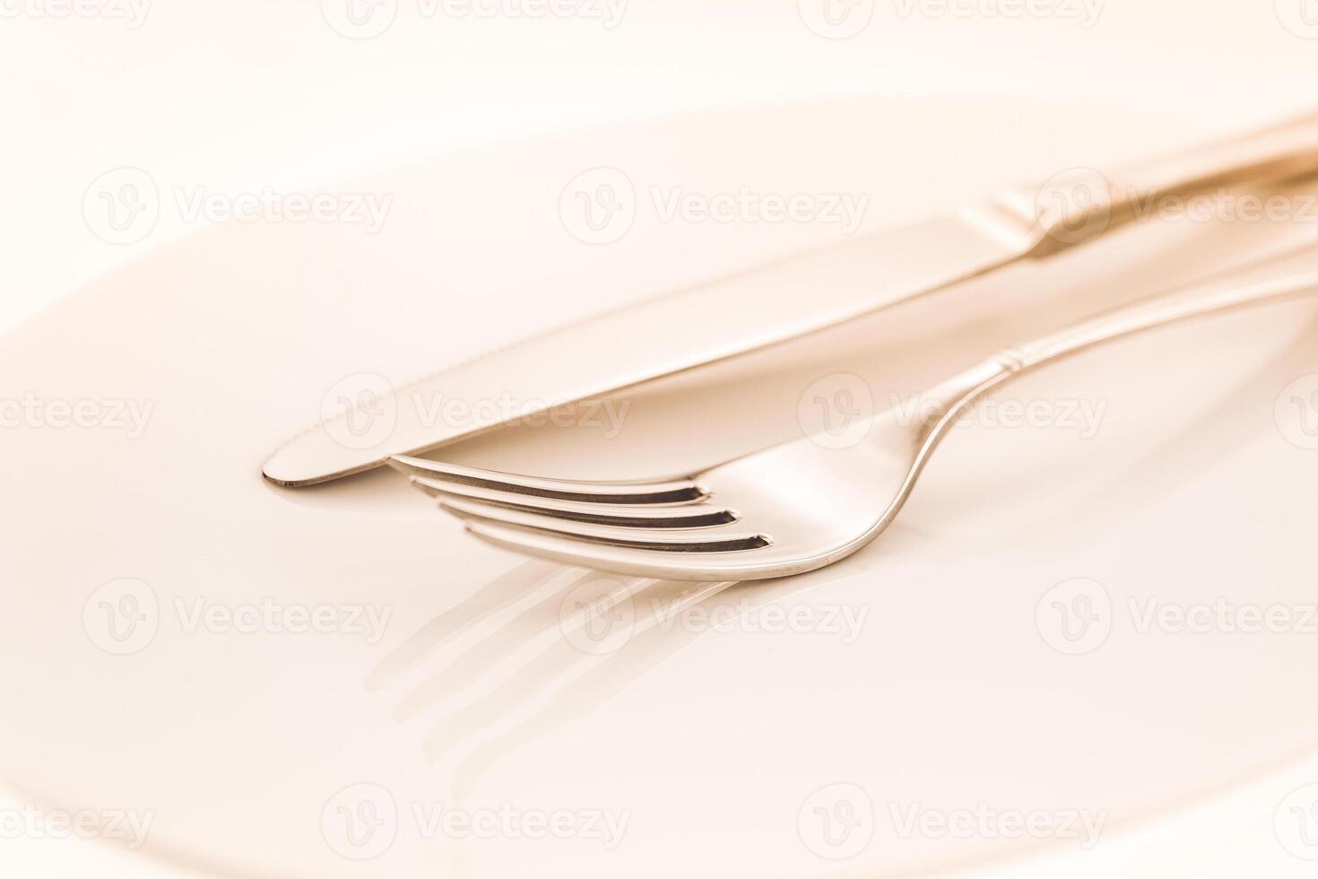 Fork and knife on a white background photo