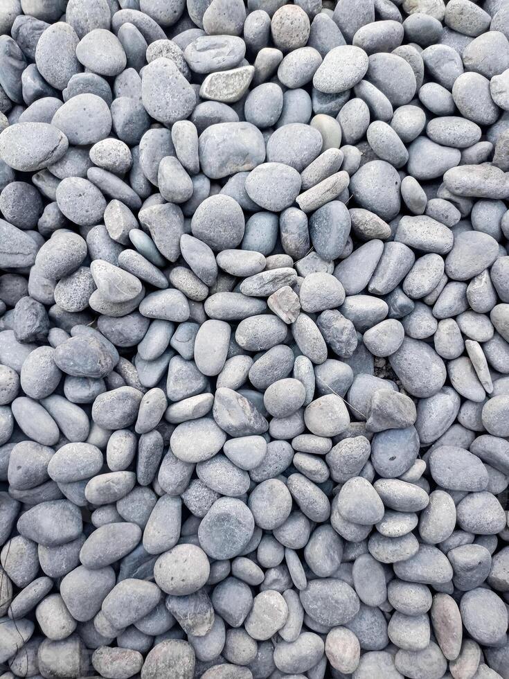 Small grey stones in close-up background texture,spa concept photo