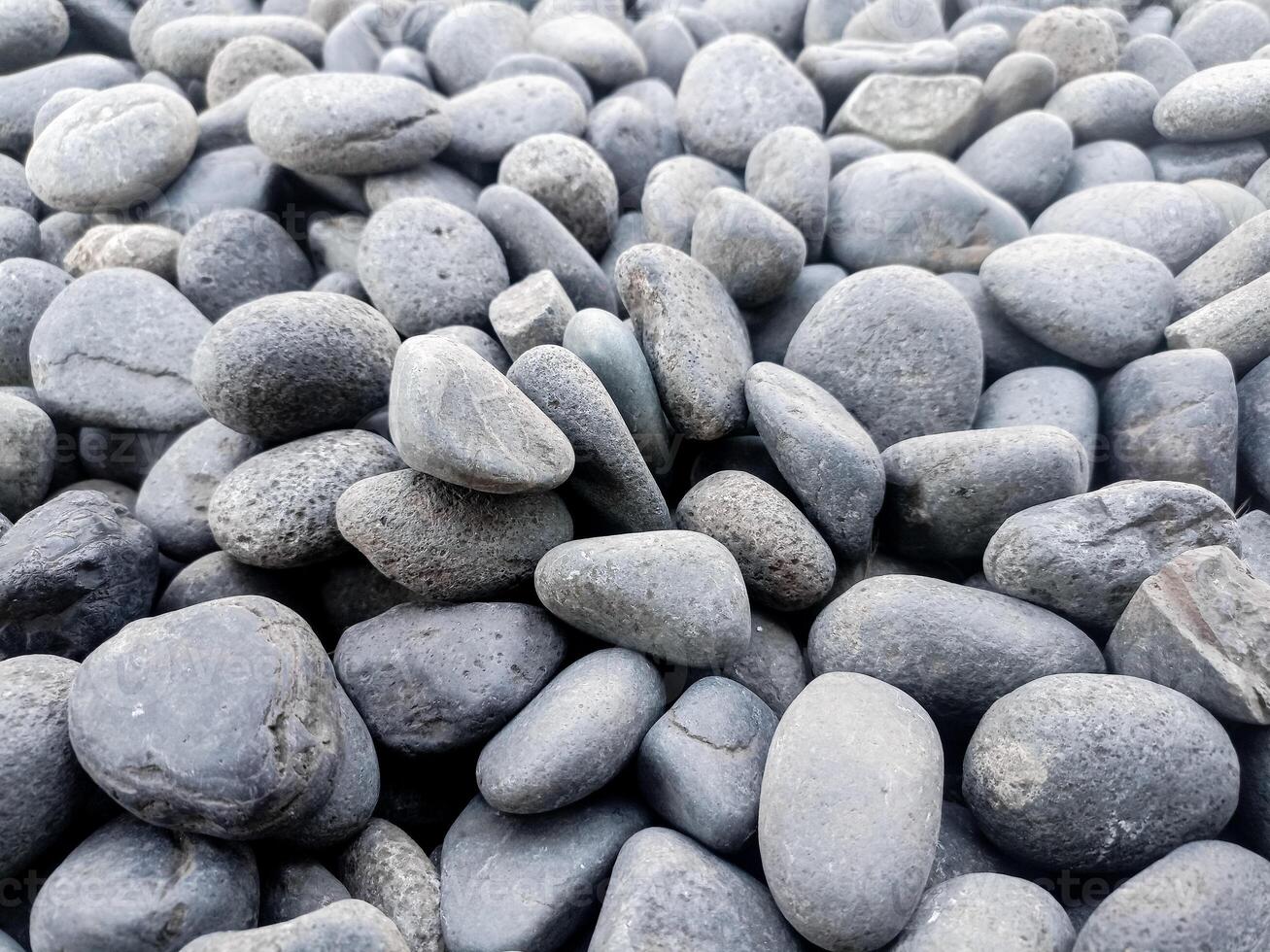 Small grey stones in close-up background texture,spa concept photo