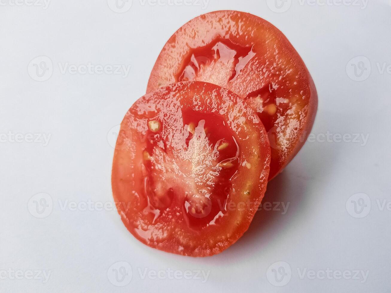 Half of fresh cherry tomato isolated on white background photo