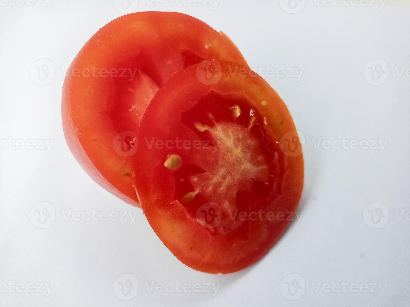 Half of fresh cherry tomato isolated on white background photo