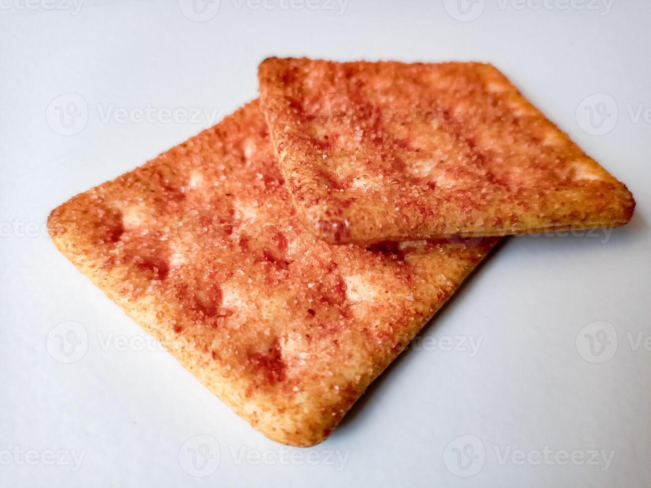 Biscuits flavoured with abon sapi or shredded beef, namely dried beef flakes, isolated on a white background. photo