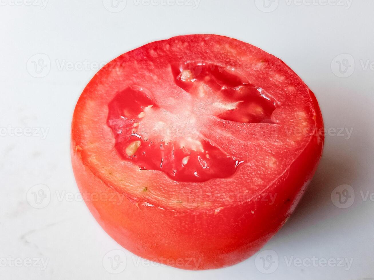 Half of fresh cherry tomato isolated on white background photo