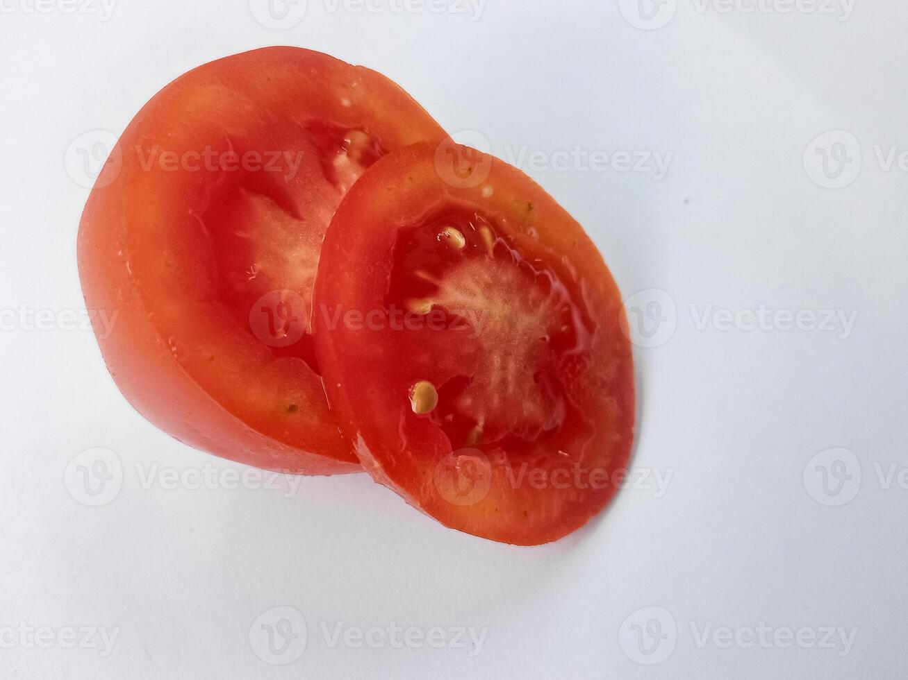 Half of fresh cherry tomato isolated on white background photo