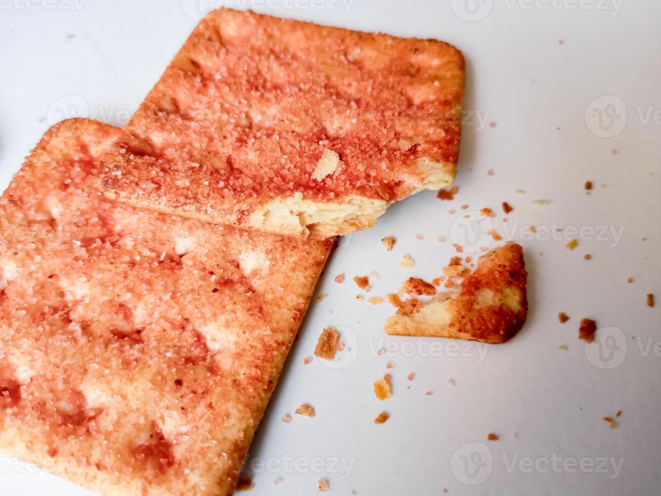 Biscuits flavoured with abon sapi or shredded beef, namely dried beef flakes, isolated on a white background. photo