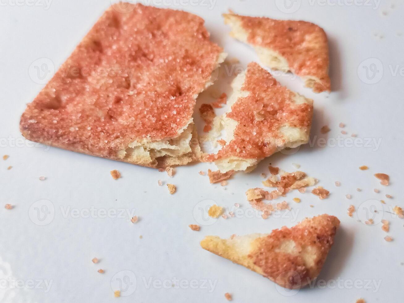 Biscuits flavoured with abon sapi or shredded beef, namely dried beef flakes, isolated on a white background. photo