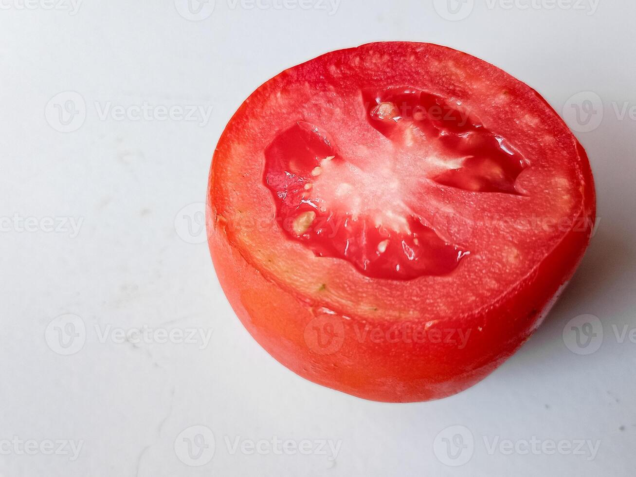 Half of fresh cherry tomato isolated on white background photo