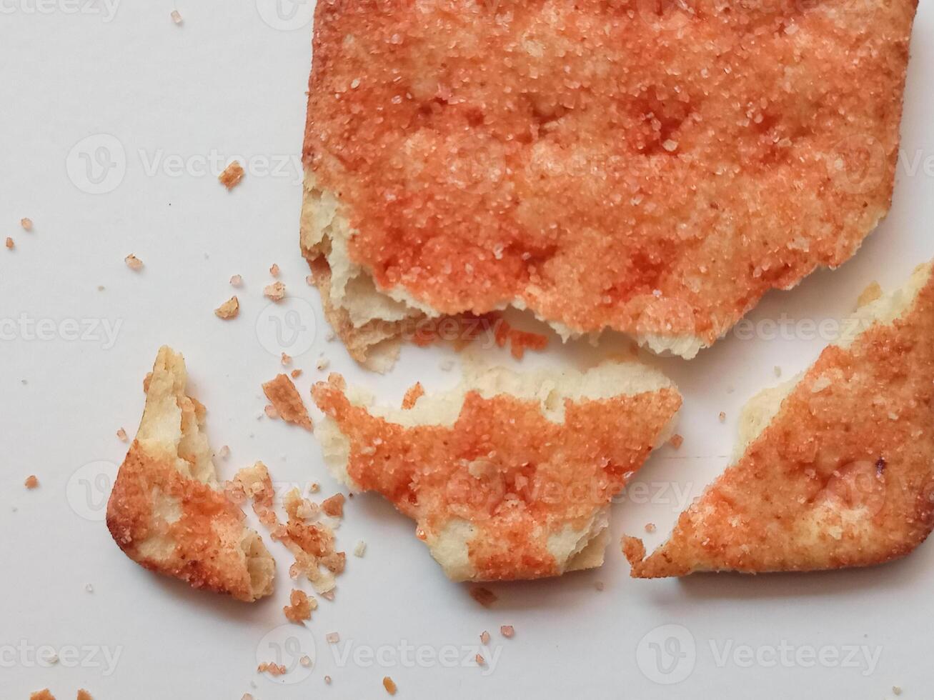 Biscuits flavoured with abon sapi or shredded beef, namely dried beef flakes, isolated on a white background. photo