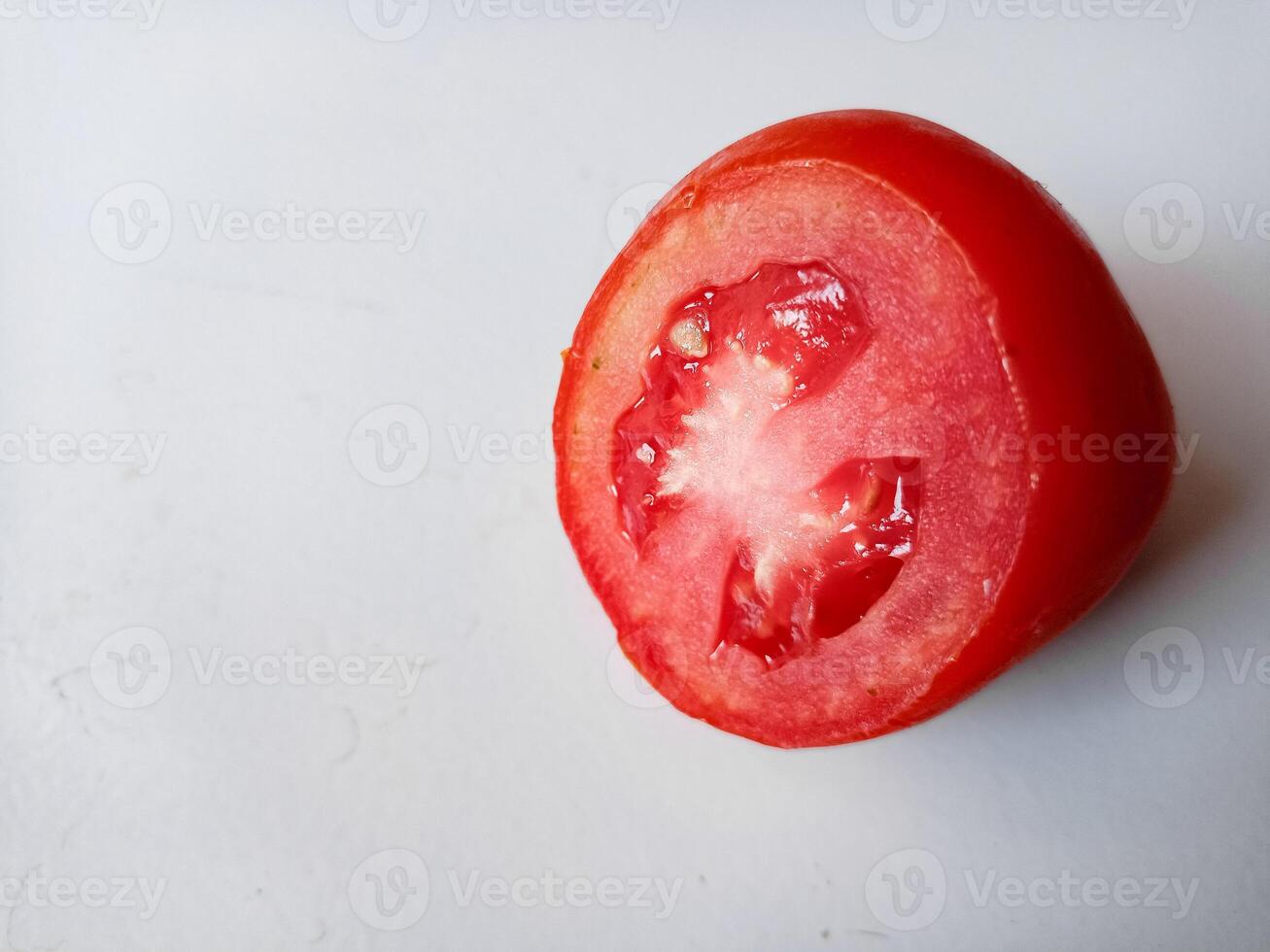 Half of fresh cherry tomato isolated on white background photo