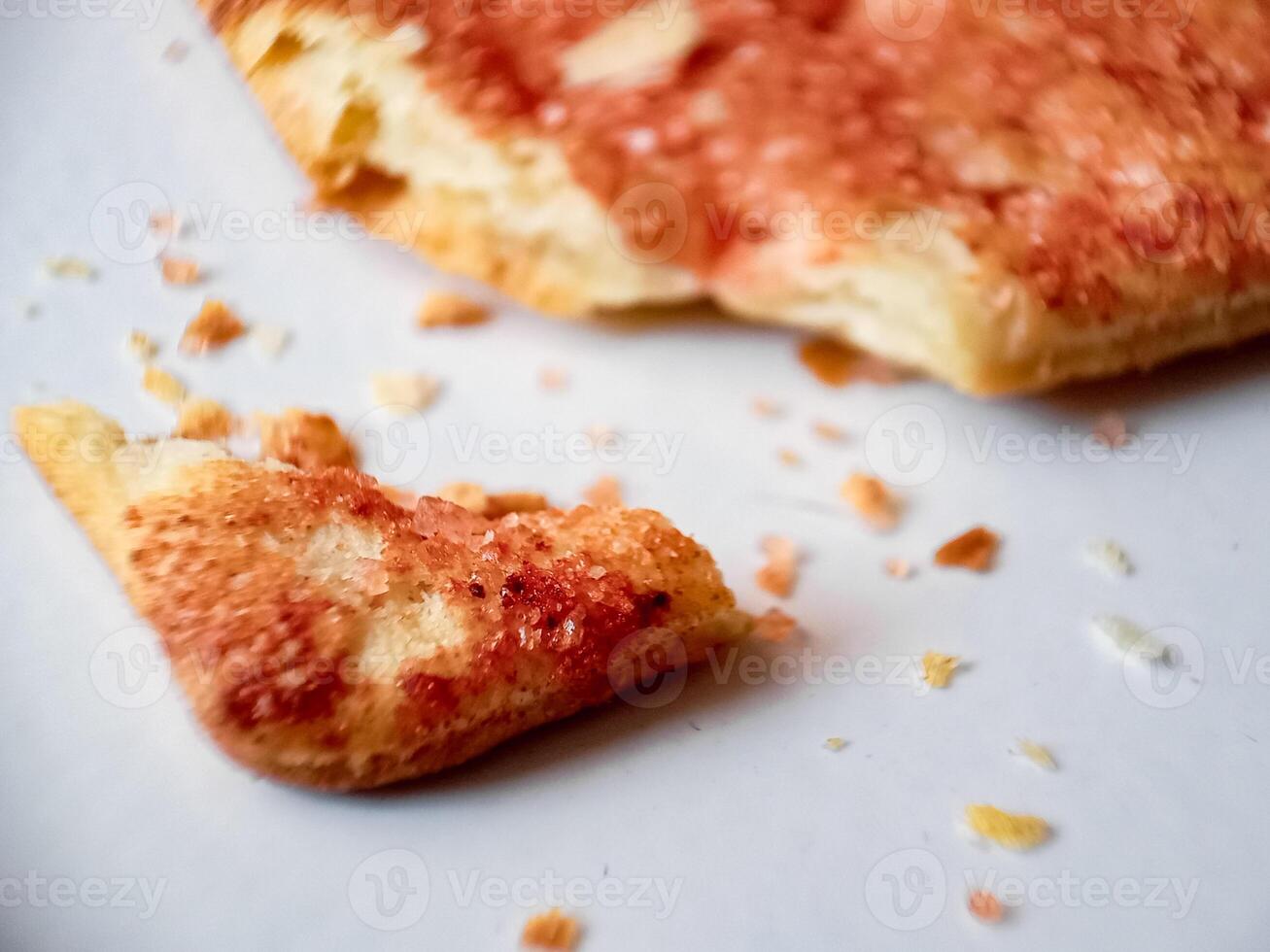 Biscuits flavoured with abon sapi or shredded beef, namely dried beef flakes, isolated on a white background. photo