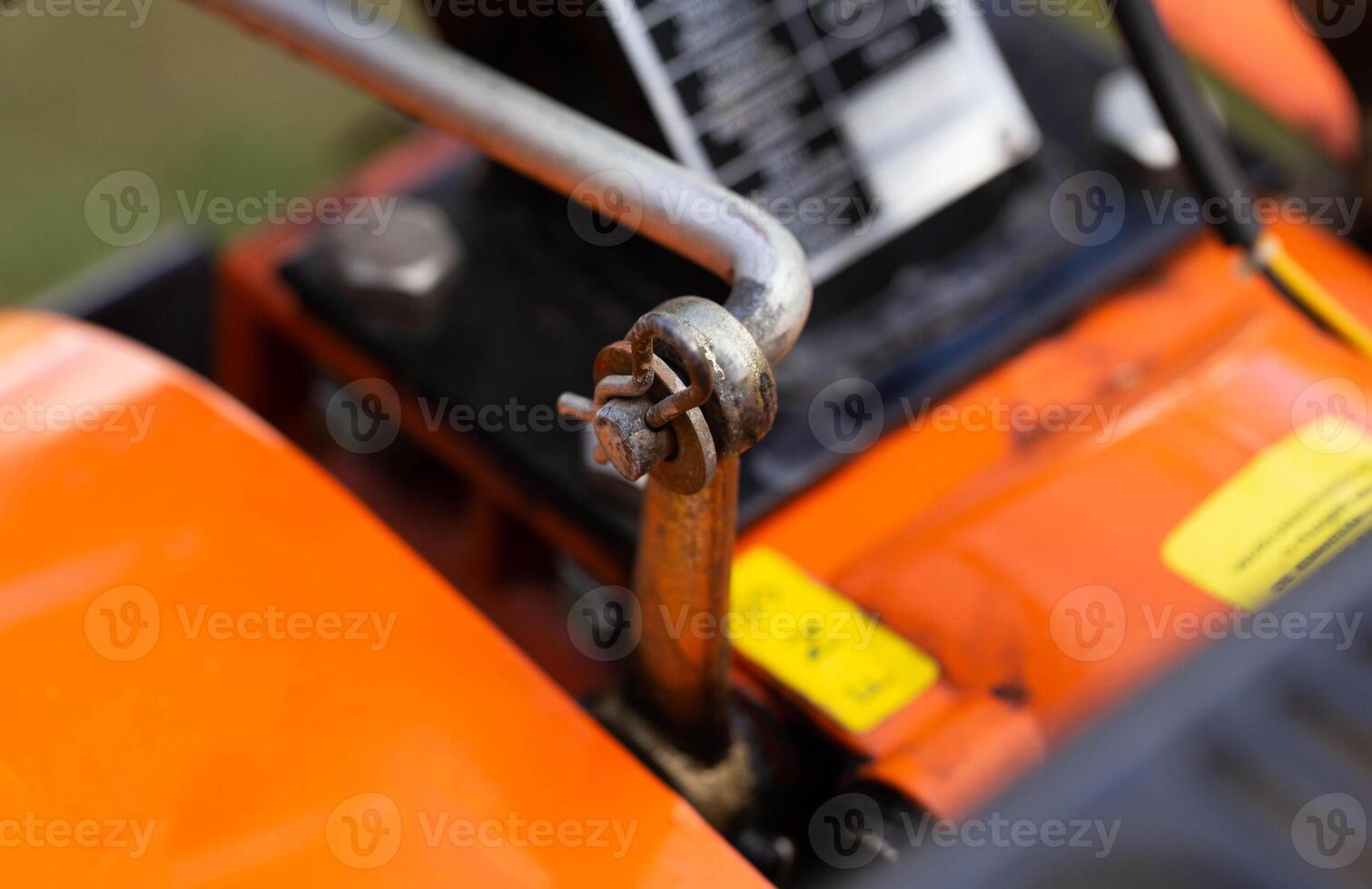 cotter pin for adjusting the gear lever in the walk-behind tractor before running in and starting work. Close-up, industry photo