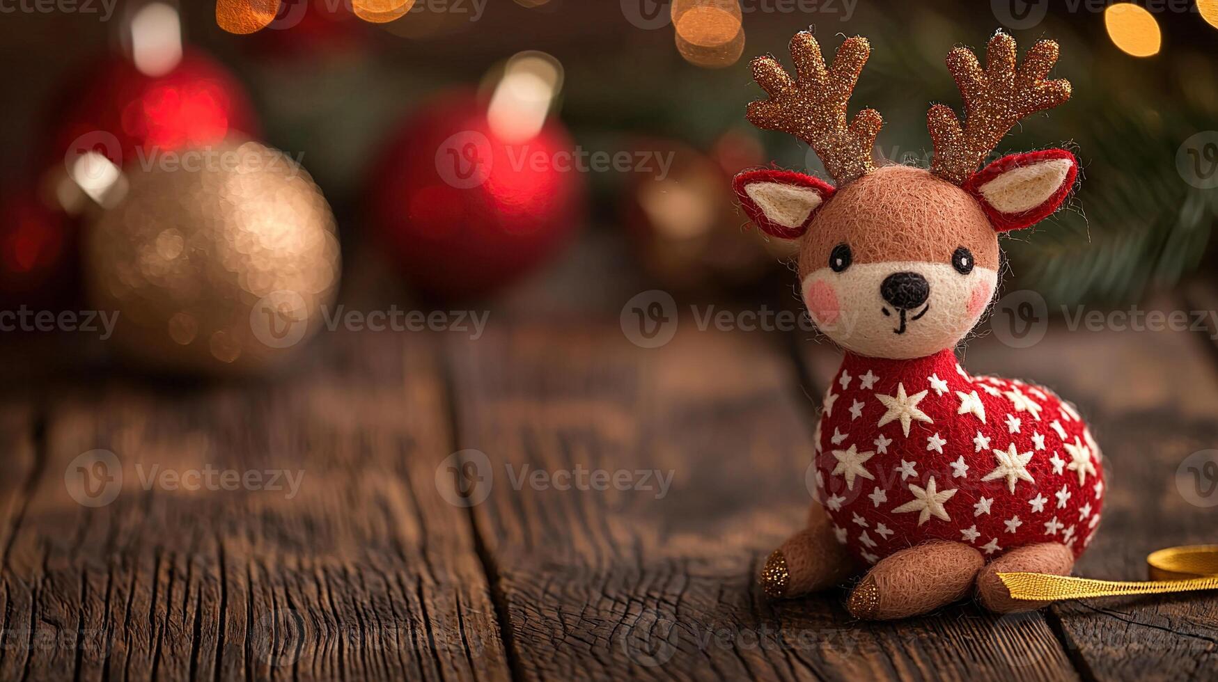A small toy reindeer is sitting on a wooden table photo