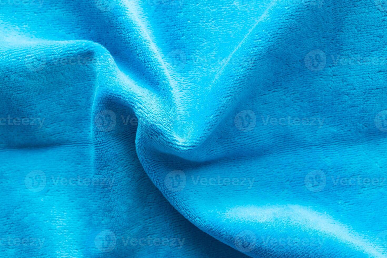 Background from blue velvet fabric, macro photo