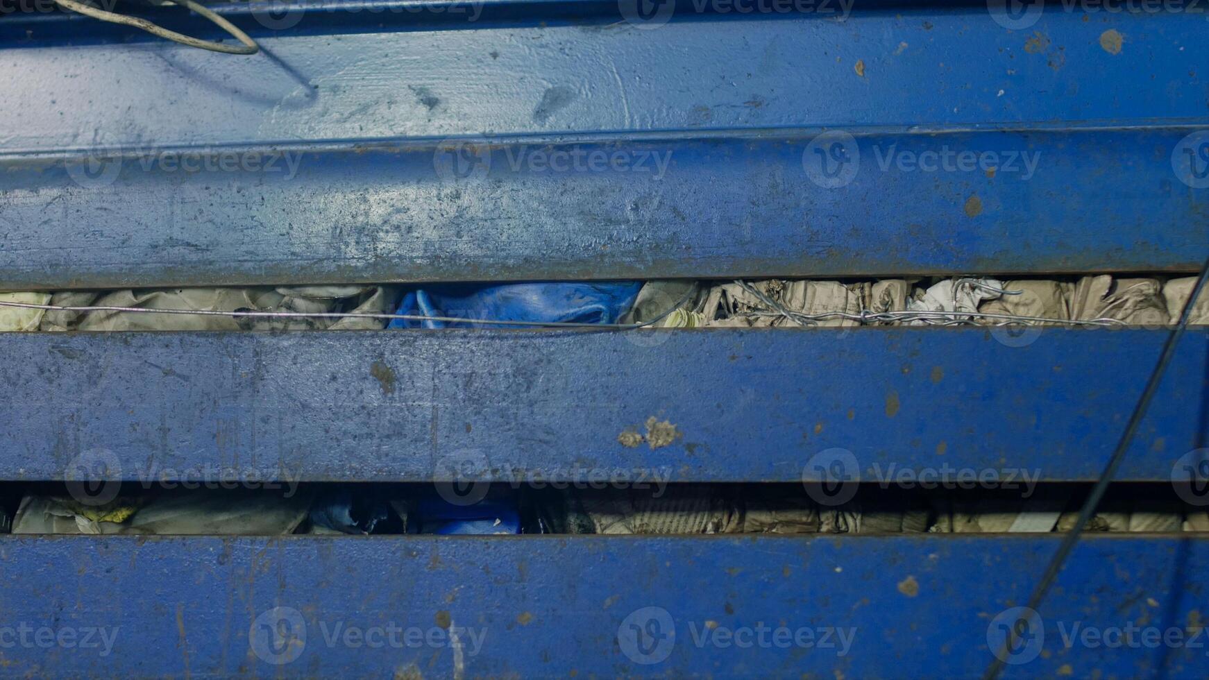 Press for pressing garbage at a waste recycling plant, close-up, environmental photo