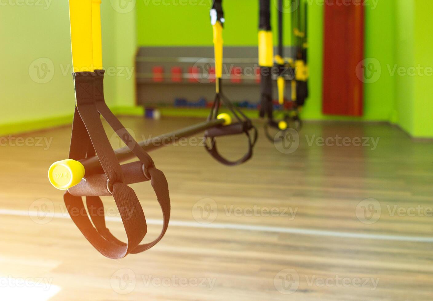 Modern new gym in the fitness center to practice a new sport of the TRX loop, sunset, copy space photo