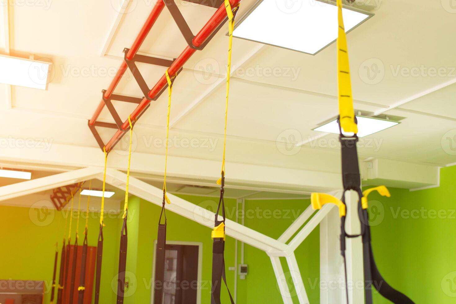 Modern new gym in the fitness center to practice a new sport of the TRX loop, metabolic photo