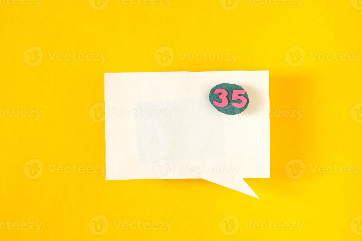 Symbol sign message from a white paper on a yellow background, social network, message photo