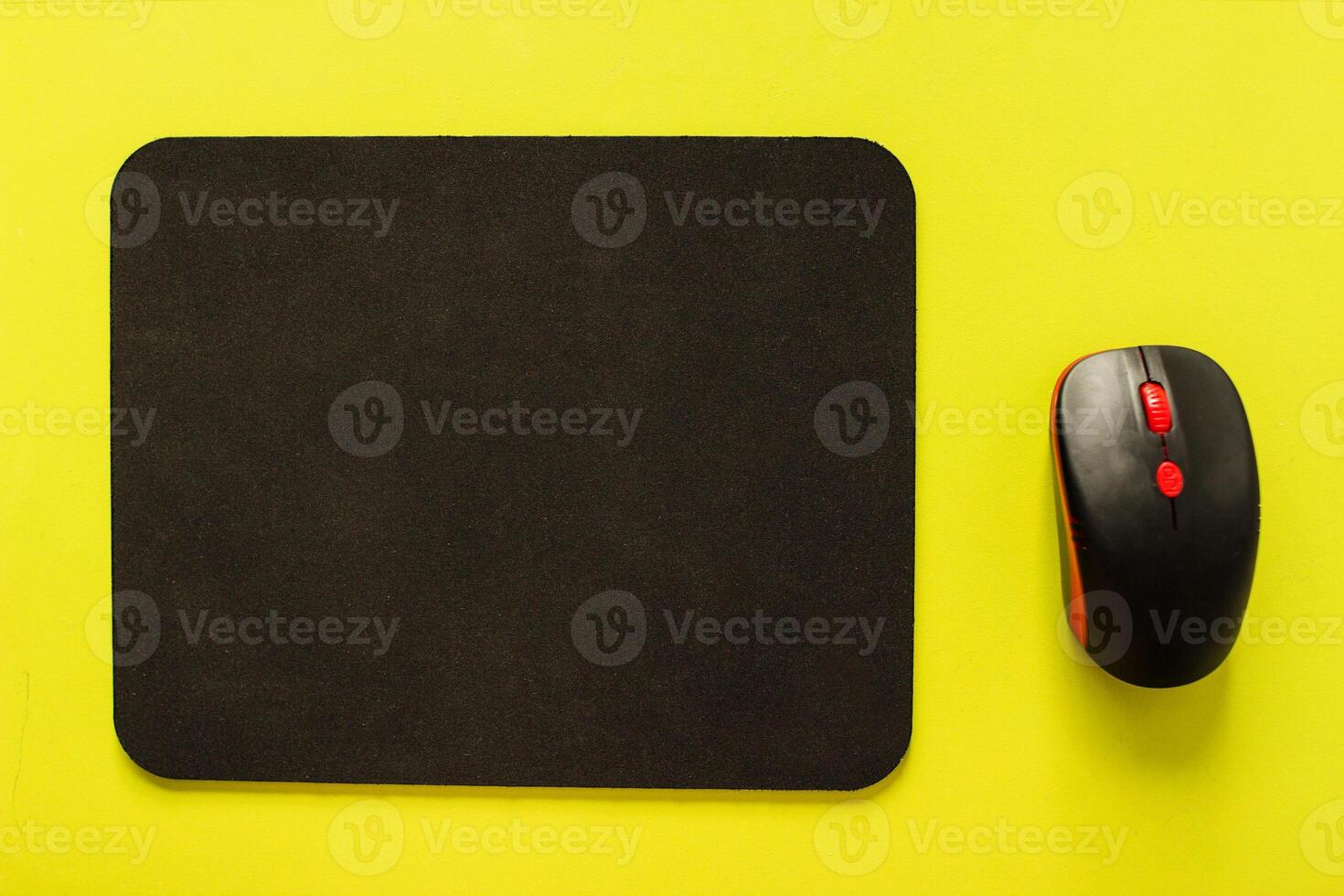Computer mat and computer mouse on a light green background, close-up, instrument photo