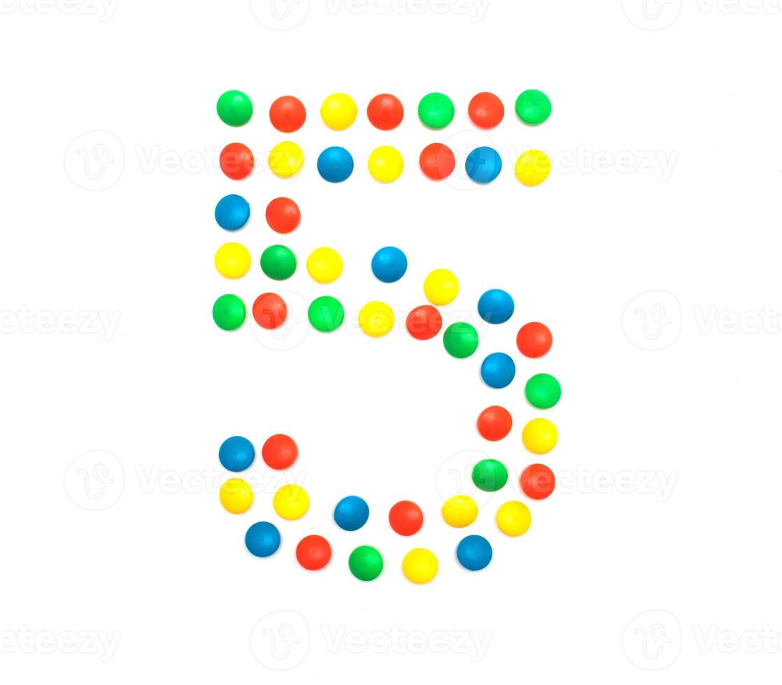 Children's numbers laid out from a multi-colored mosaic figure number 5, alphabet photo