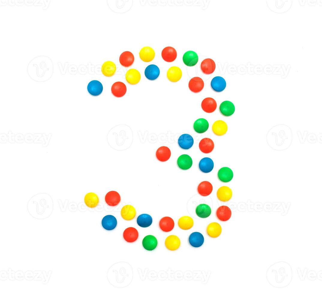Children's numbers laid out from a multi-colored mosaic figure number 3, alphabet photo