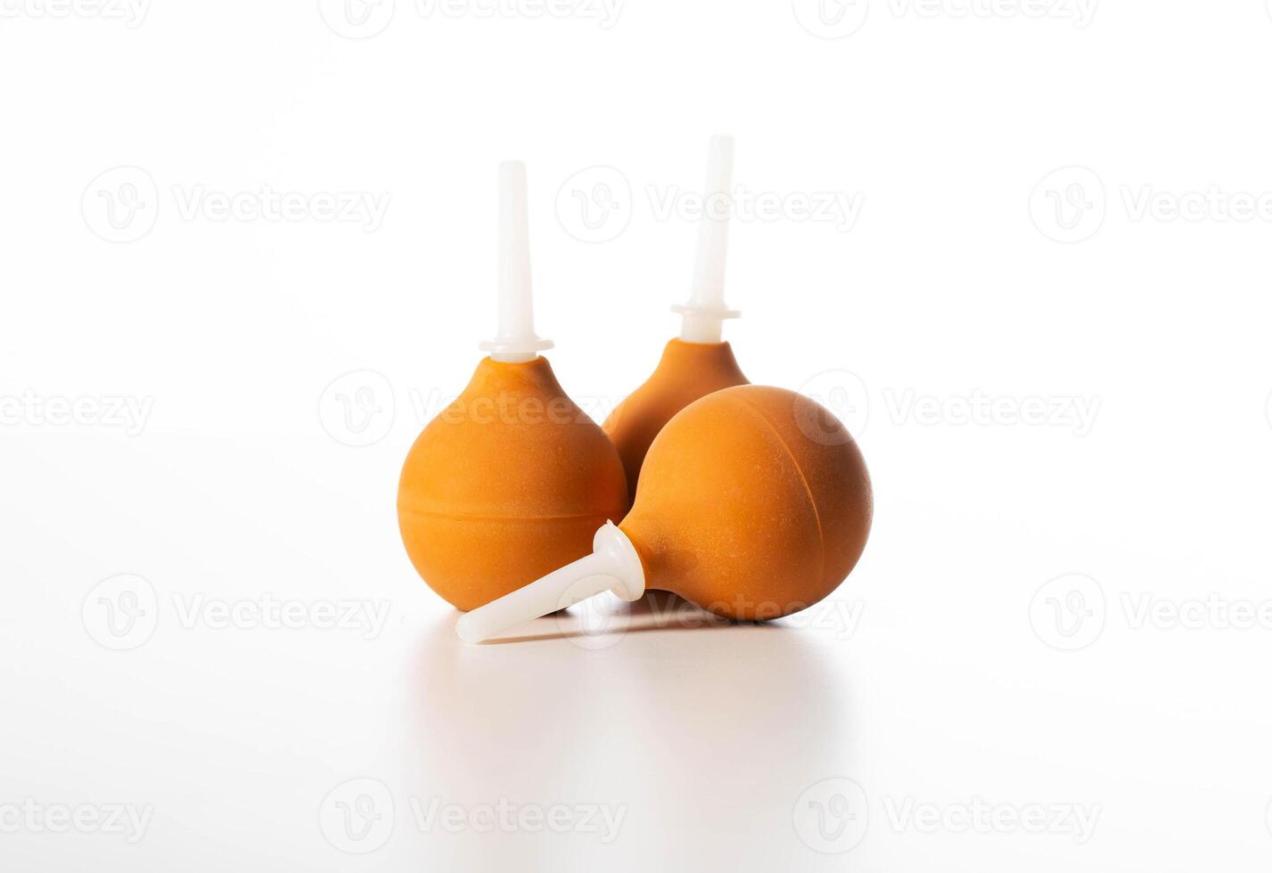 Brown medical syringes on a white background, isolate, close-up, instrument photo