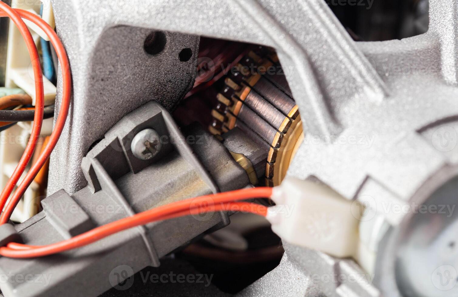 Malfunction and replacement of electric brushes in washing machine motors, macro photo