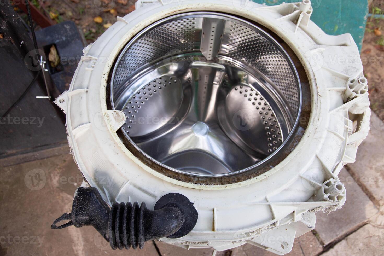 Disassembling the washing machine drum to replace the cross. Washing machine breakdown and repair, close-up photo